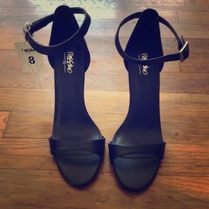 Black high heels, never worn
